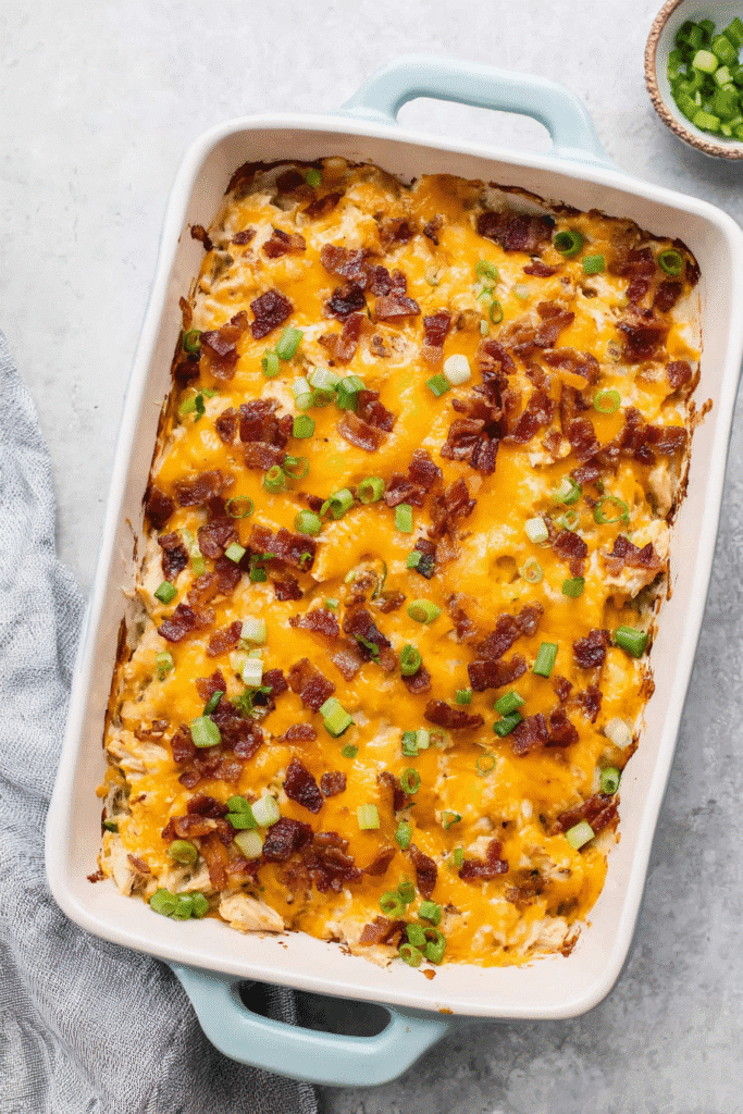 crack chicken casserole in a rectangular ceramic baking dish with light blue handles